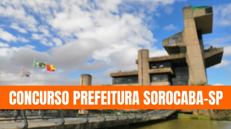 Concurso em Sorocaba-SP: últimas horas para se inscrever nas 26 vagas na área da saúde 1 Prédio moderno, três bandeiras hasteadas, faixa laranja com texto sobre concurso público